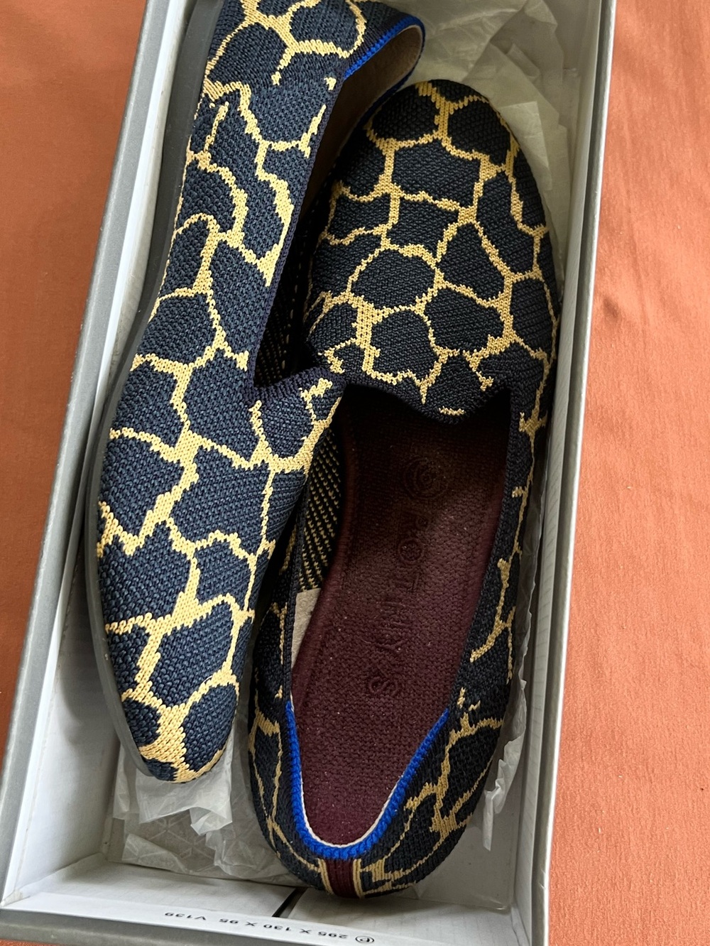 Rothy's Black and Tan Giraffe-Print Slip-On Flats